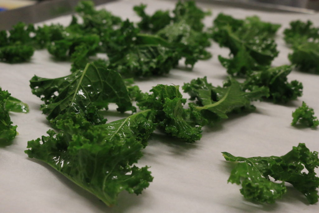 toss kale in olive oil