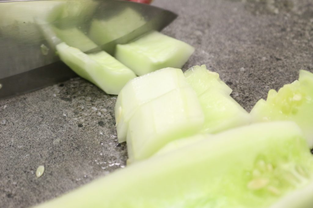 chopping cucumber