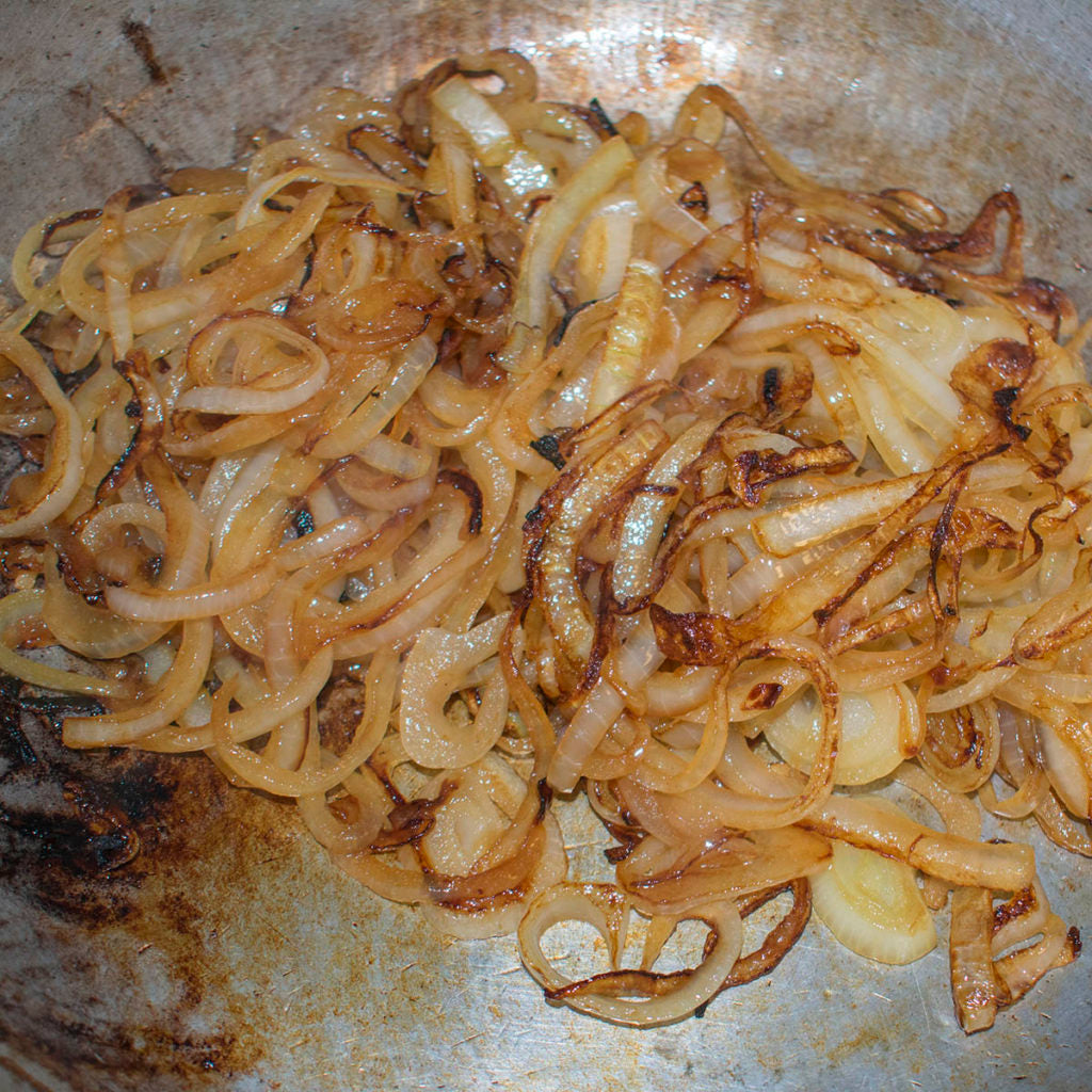 Saute the onions over a low heat stirring frequently until they are golden brown and sweet in flavor