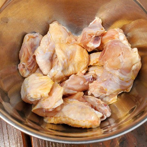Pat wings dry and lightly oil them with avocado oil