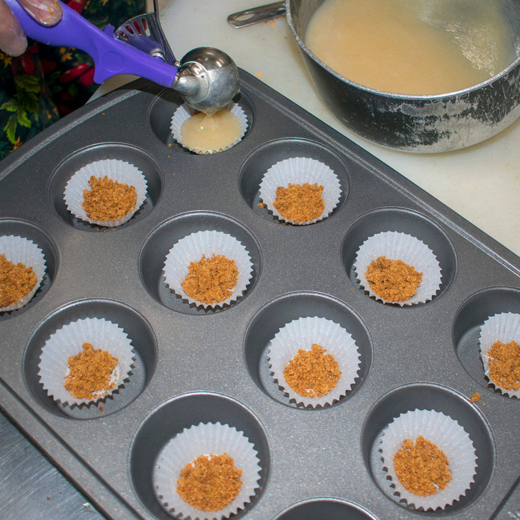 spoon enough of the cheesecake mixture into each cup to fill it almost up to the top