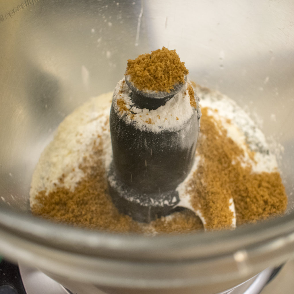 In a food processor, combine coconut oil, molasses, vanilla, and coconut sugar