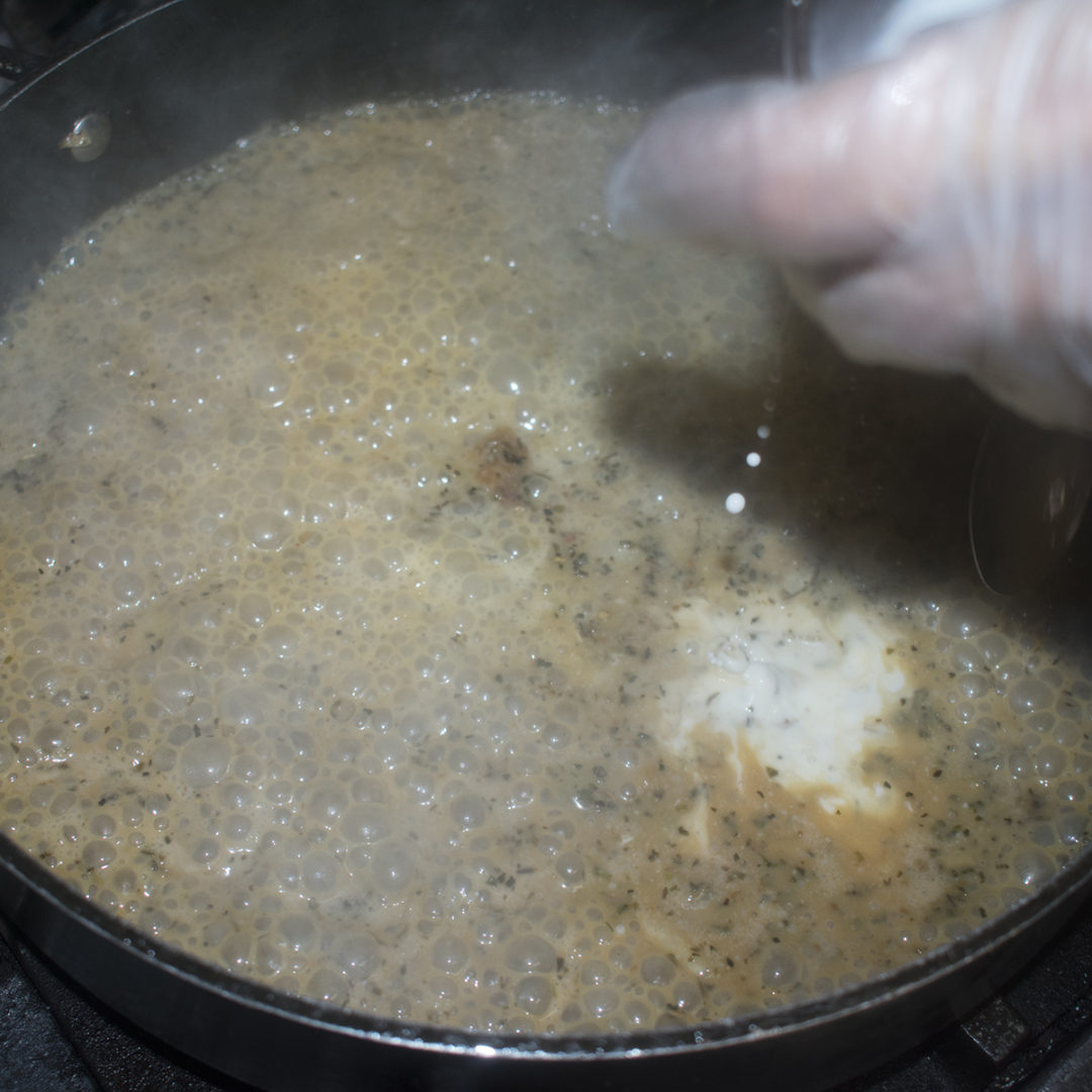 Season with salt and continue to cook to reduce down slightly