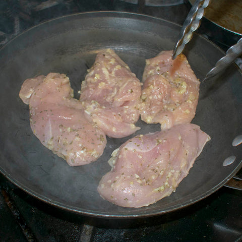 Sear the chicken until golden brown on one side