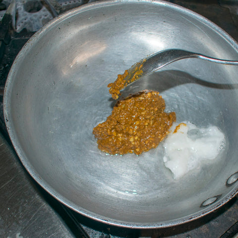 heat coconut oil in skillet