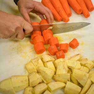 Cut the potatoes and carrots