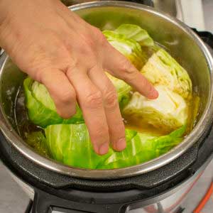 Place cabbage into the pressure cooker and cook for 5 minutes