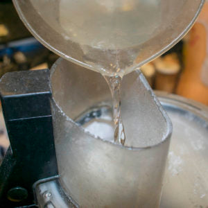 turn on processor and pour steady stream of water
