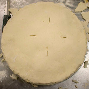 roll out top curst and place it on top of pie
