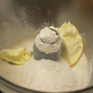 place flour shortening and salt in food processor