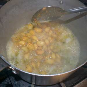Add both the roasted garlic and the remainder of the raw garlic cloves and cook