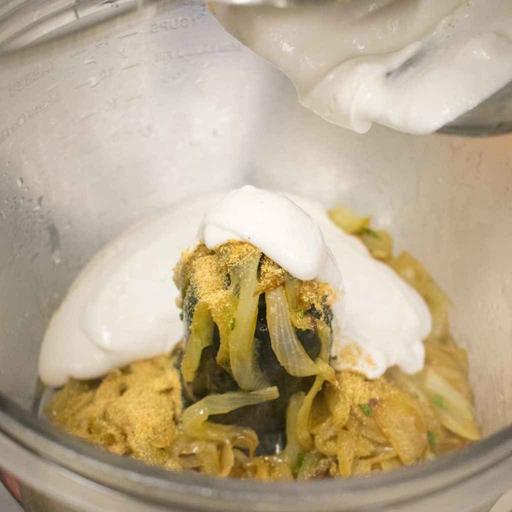 Put chilled coconut cream in a bowl. Stir in the cooled caramelized onions, salt, and garlic powder. Cover dip and refrigerate overnight to allow flavors blend.