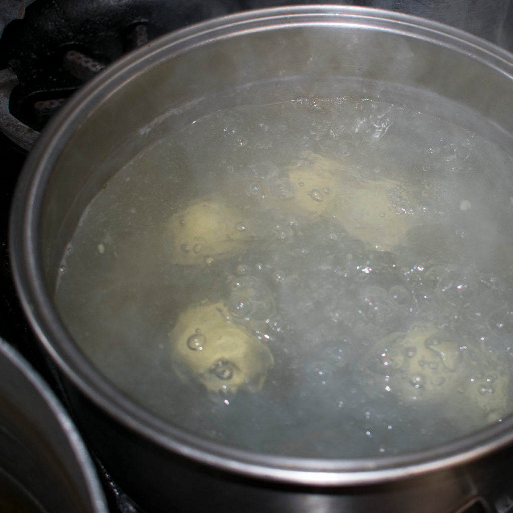 Simmer them until they float to the surface