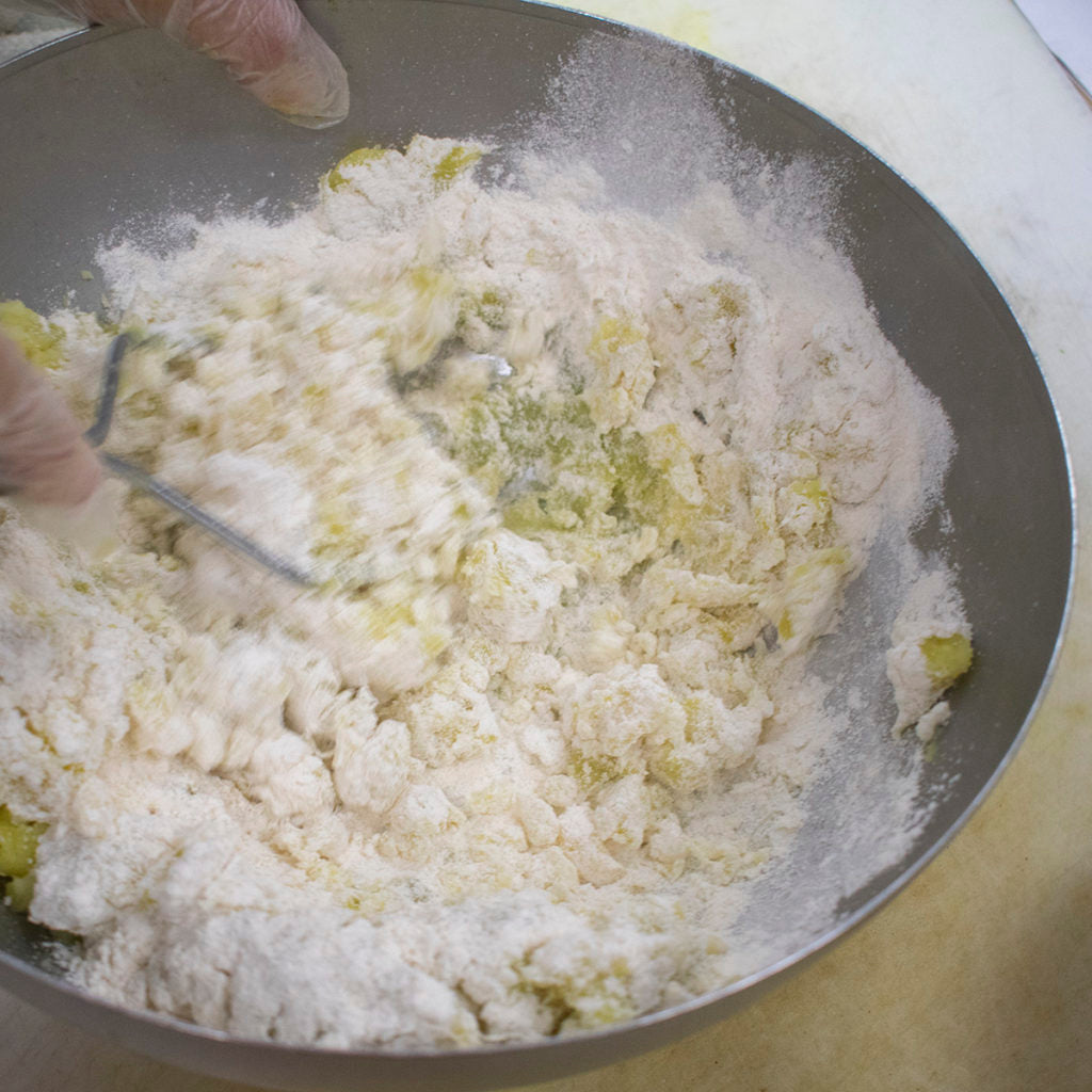 Continue to mash AIP potatoes until a soft dough forms