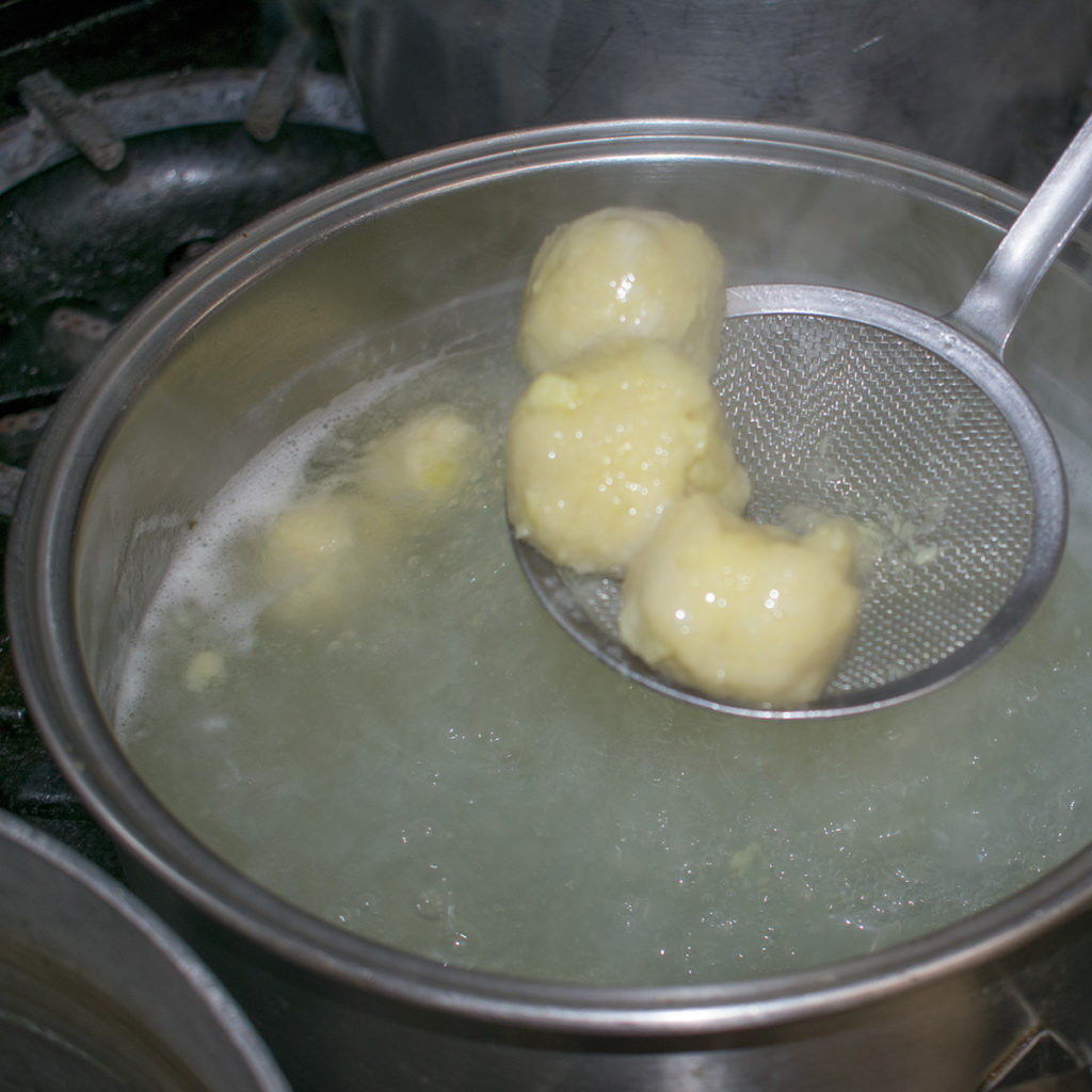 Remove AIP german potato dumplings with a slotted spoon to a plate