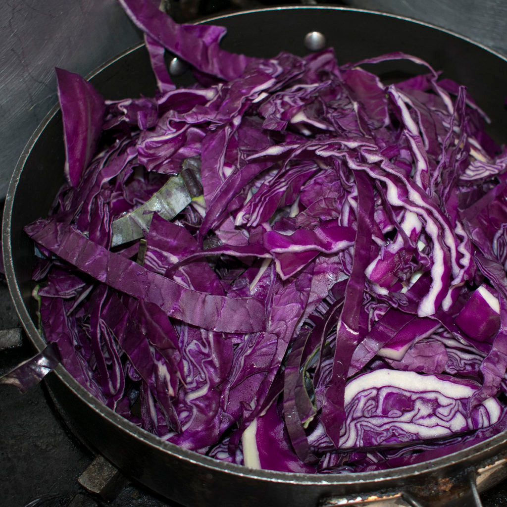 Sauté sliced cabbage in olive oil in a large skillet