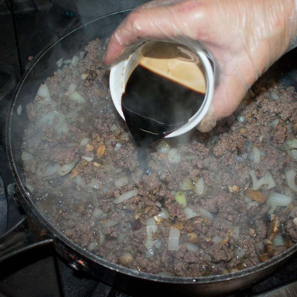 Add the balsamic vinegar and bring the sauce to a simmer.