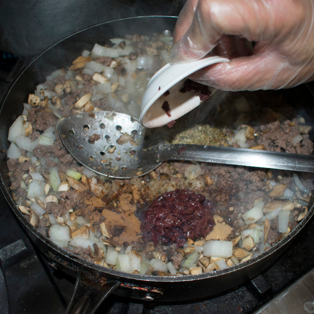 Add in minced olives to the pan