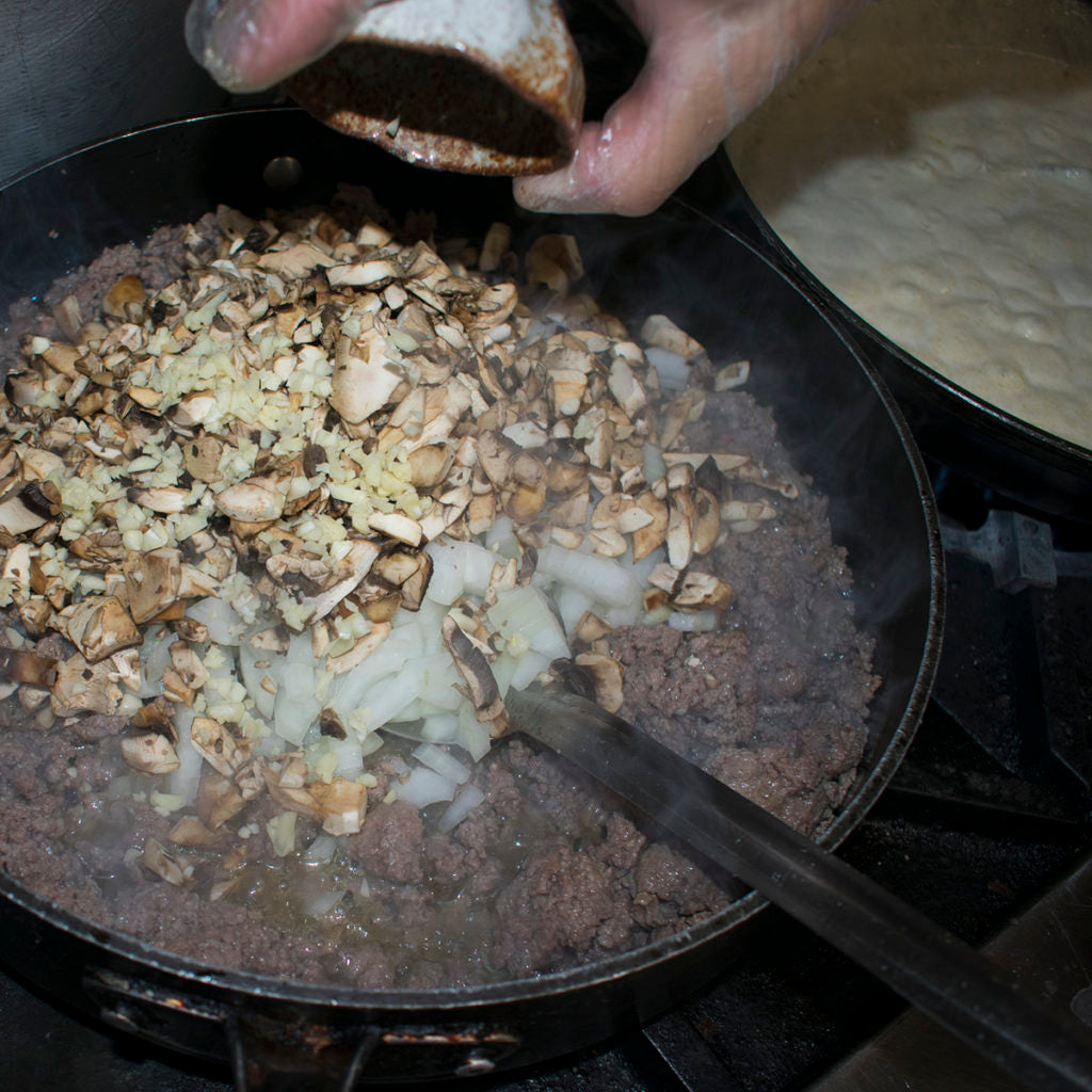 Next, pour in minced garlic cloves