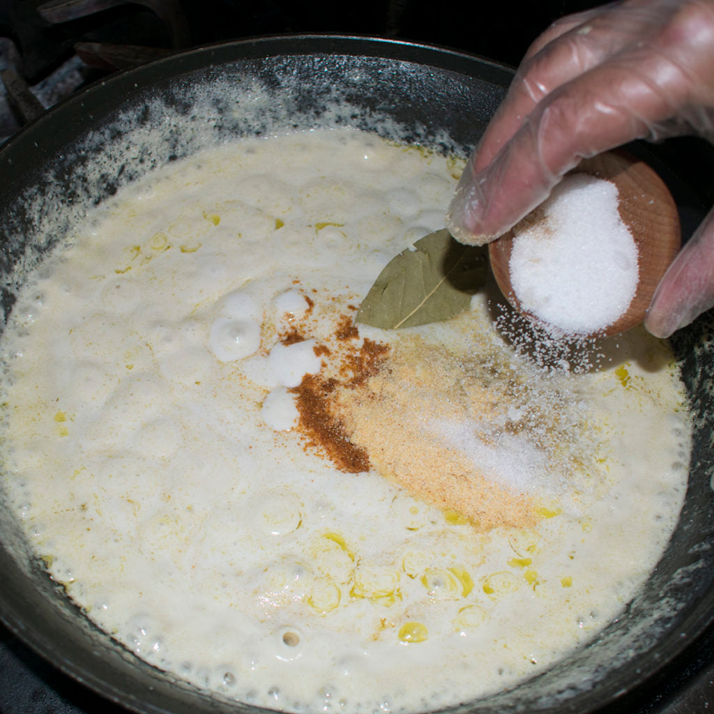 Pour in salt to the roux