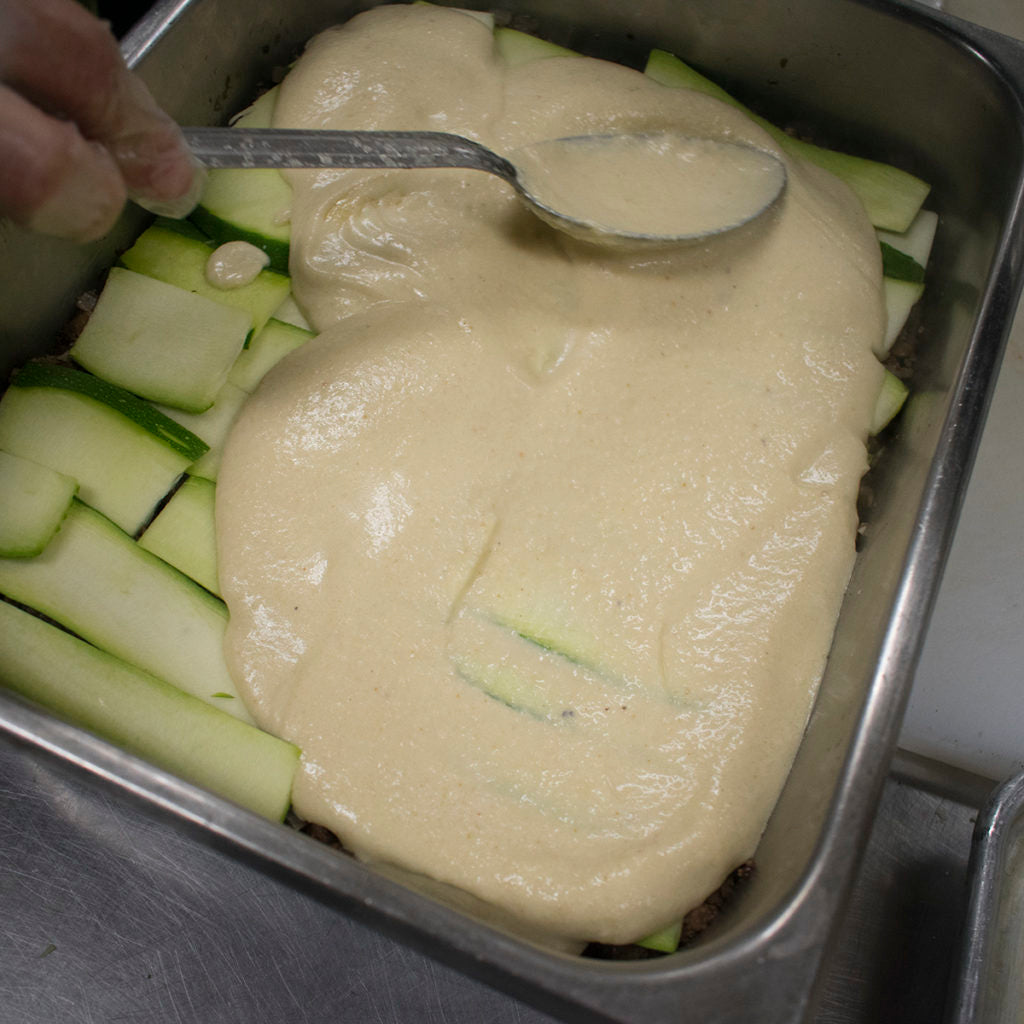 Ladle the bechamel over everything