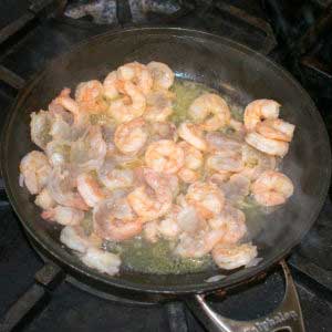 Cook the shrimp in a pan until pink