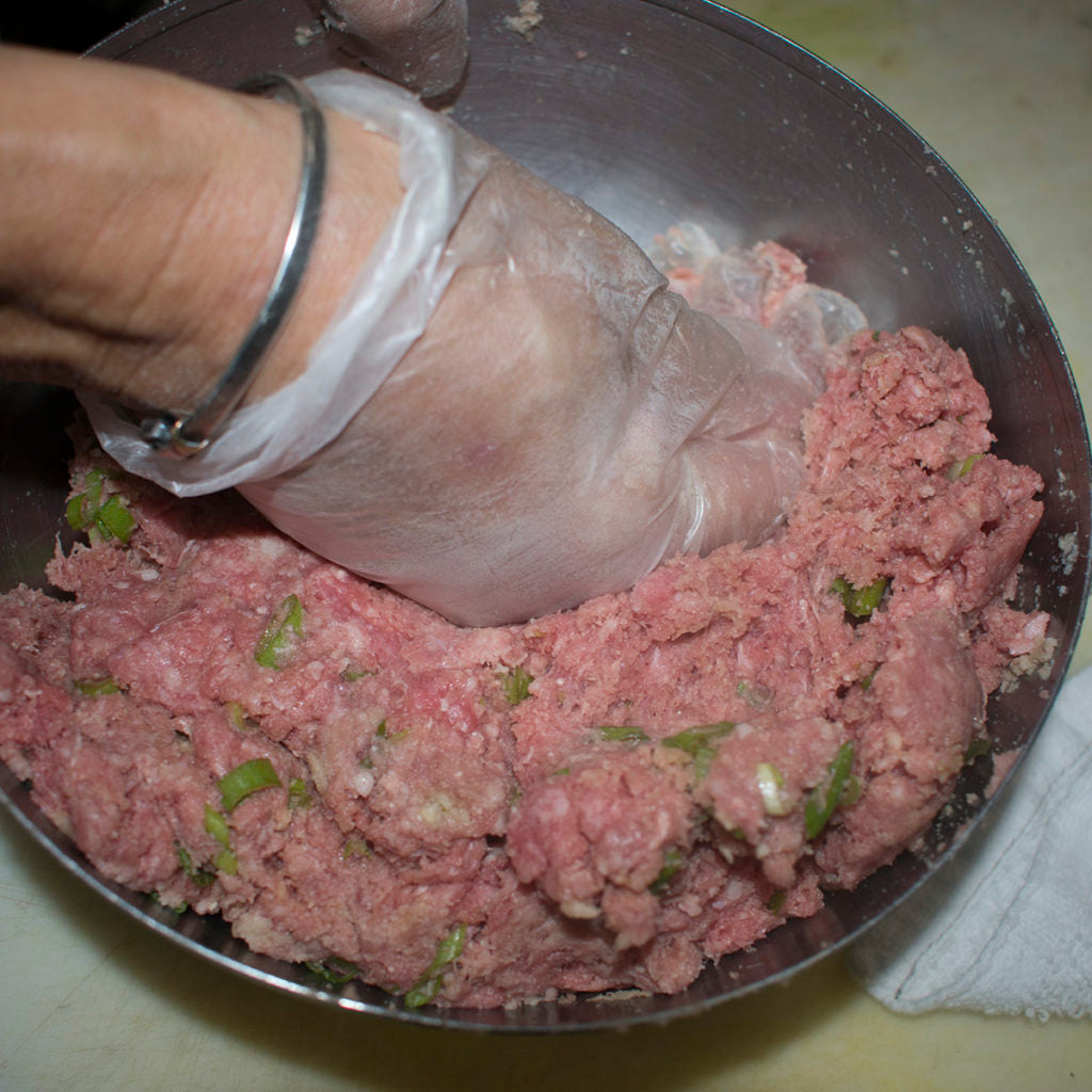 Mix together meatball ingredients until well combined