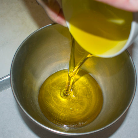 pour oils into bowl