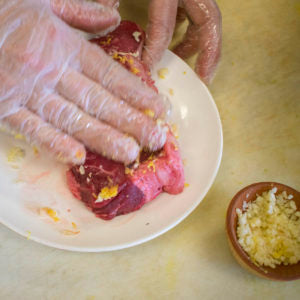 Rub the yak steak with the lemon zest, garlic and salt