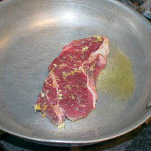 Add olive oil to the pan and sear the yak steak