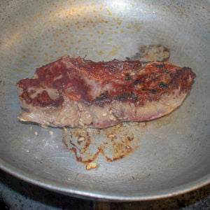 Once seared on one side, turn the steak