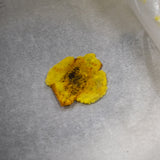 Press the plantain chunks into disks using a heavy pan or a tortilla press