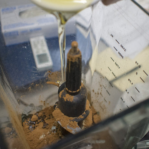 Add carob powder and avocado oil to the food processor