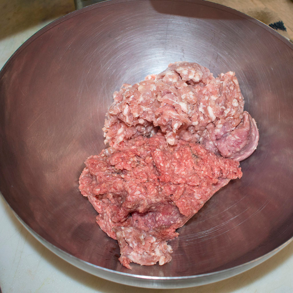 Combine ground pork and ground beef in a mixing bowl