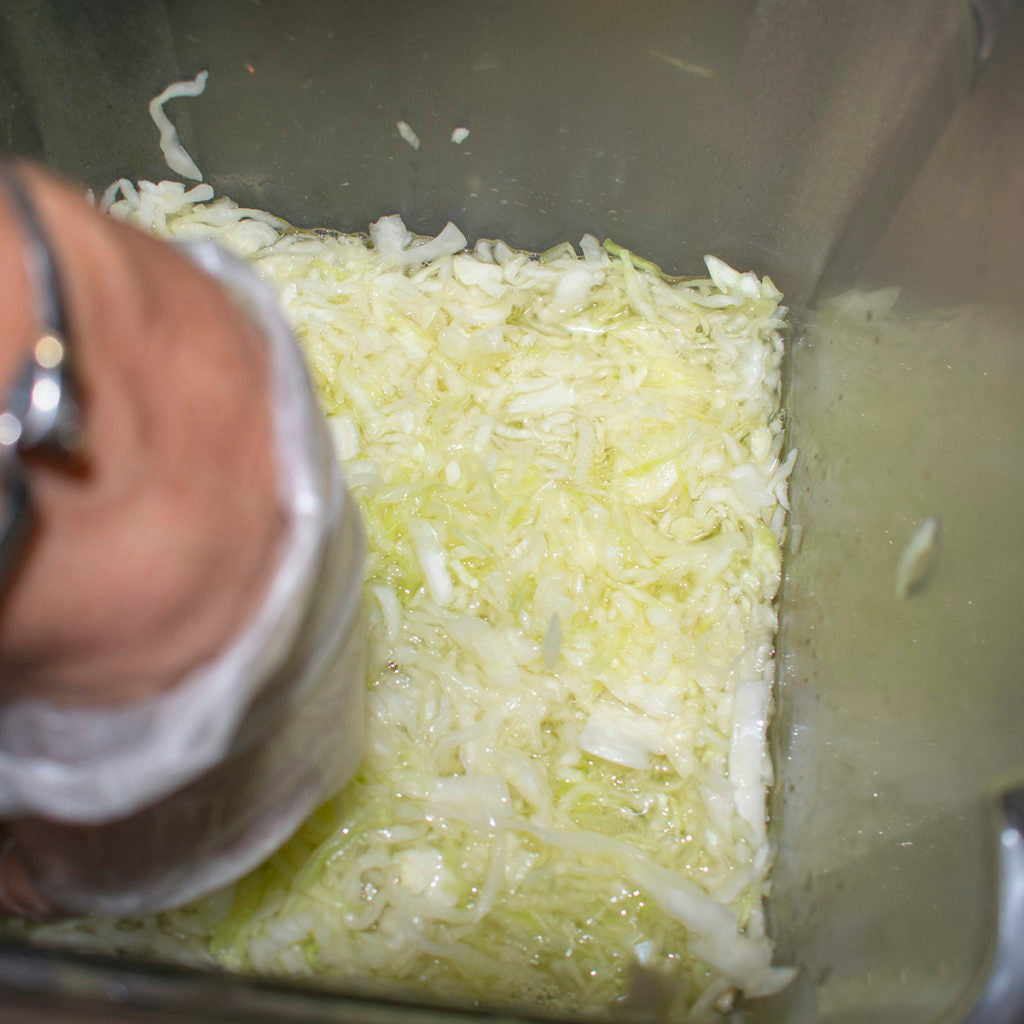 Pack the cabbage into the jar.