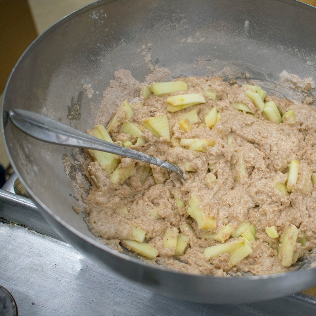 Fold diced apples into cake batter