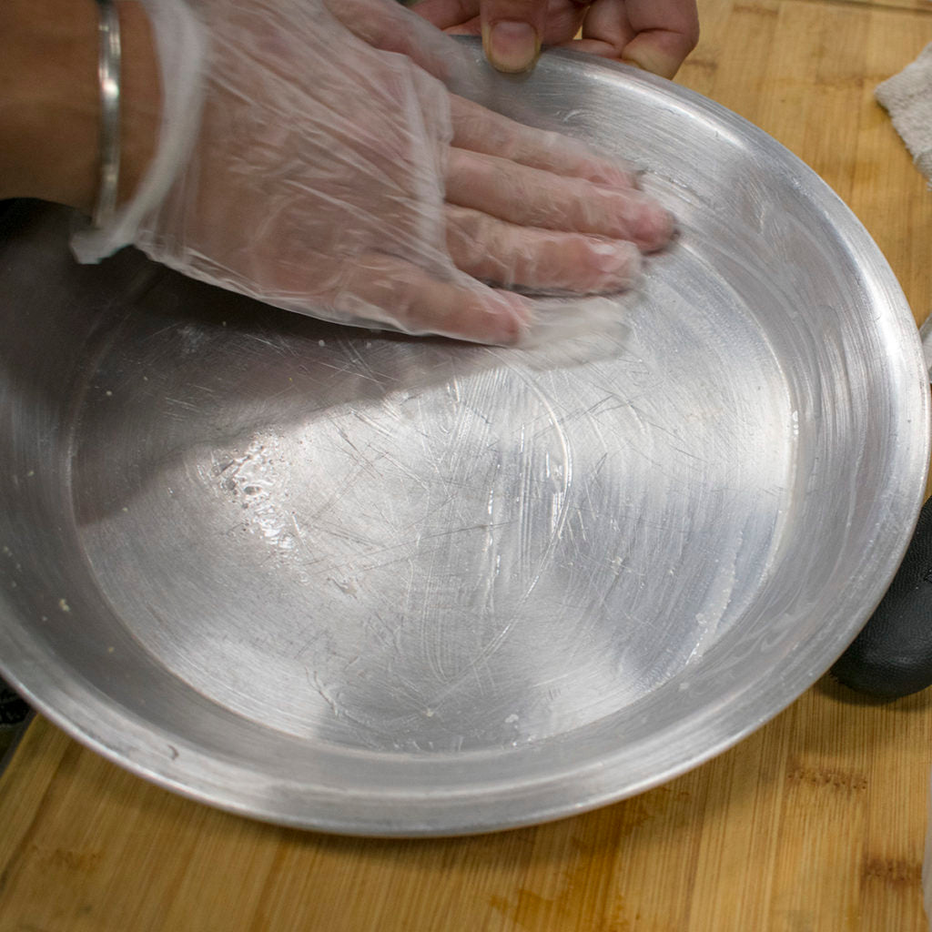 Grease a 9'' round cake pan with coconut oil
