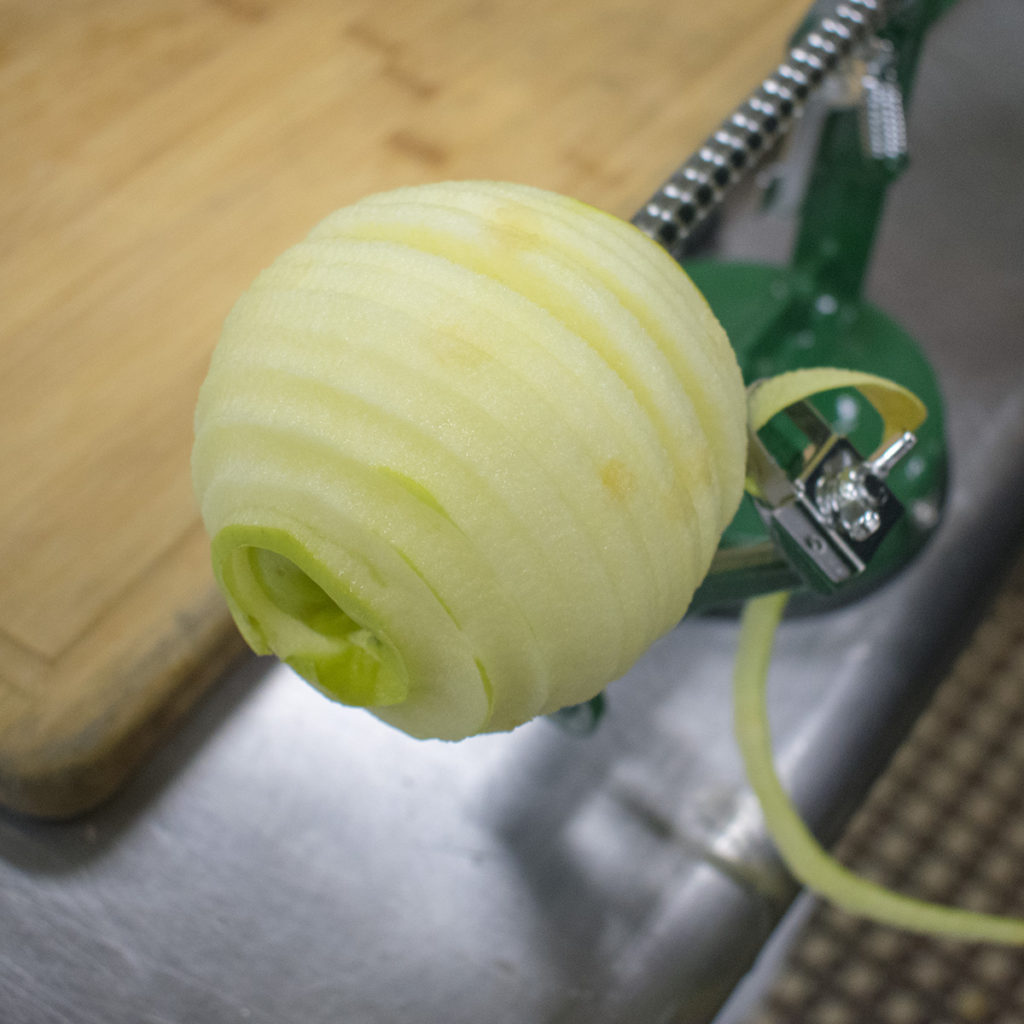 Peel, core, and slice 2 of the apples
