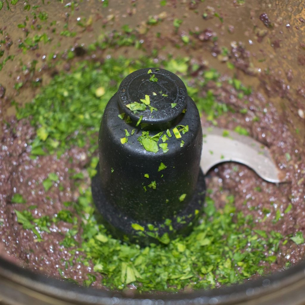 Blend ingredients together then garnish with parsley leaves and olive oil.