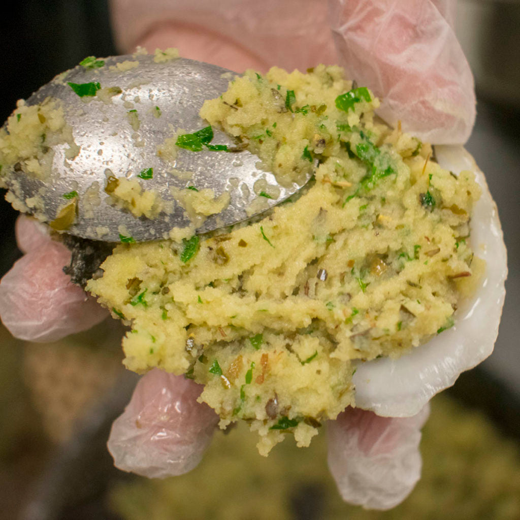 Spoon a tablespoon or two of puree over each oyster and pack in on with your hand.