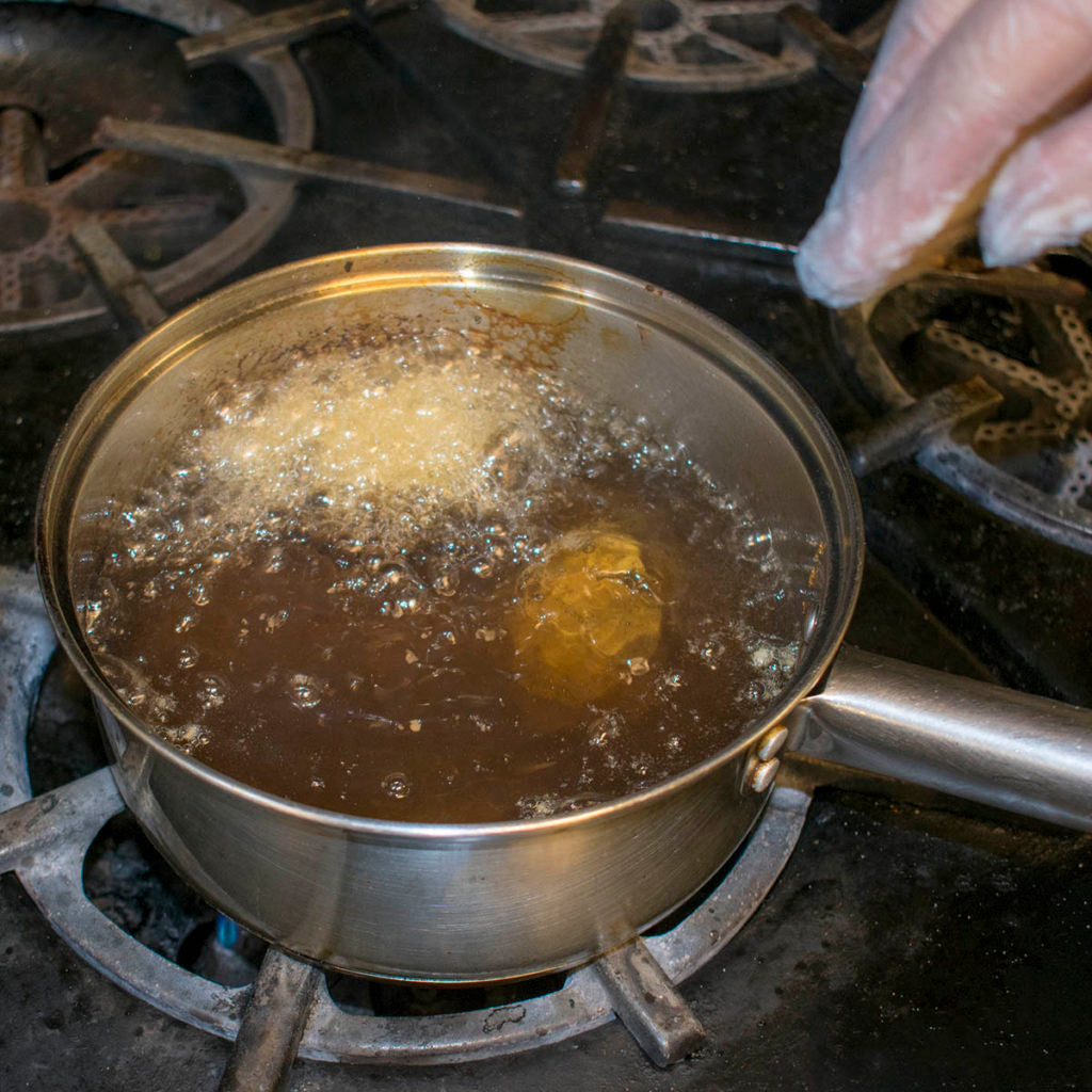Gently lower the oysters into the hot oil