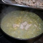 Add the shredded chicken to the stew