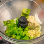 combine the peeled kiwi with the quartered onion, lime juice, minced garlic, horseradish chopped cilantro and oregano