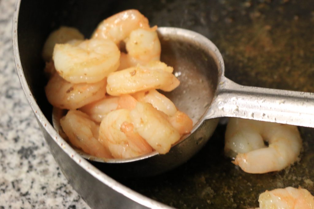 Heat olive oil in a saute pan and add shrimp