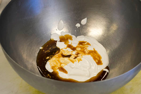 heat low, cool, skim cream off can of coconut milk, mix with maple syrup and vanilla