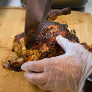 Slice the cooked peruvian chicken