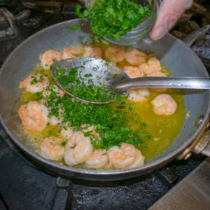Add chicken stock and parsley