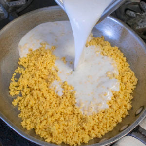 In a saute pan, add the plantain grains and coconut or almond milk