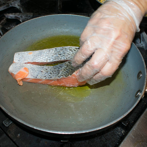 add salmon top side down to hot oiled skillet