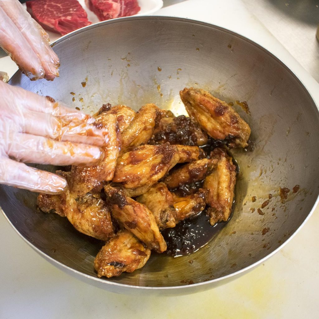 toss aip chicken wings to coat